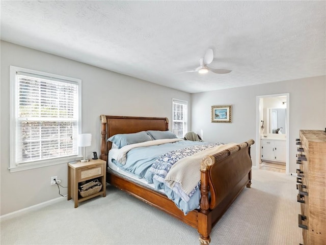 2466 Thrasher Rd, Buford, GA 30519 - carpeted bedroom with baseboards, ceiling fan, ensuite bath, and a textured ceiling