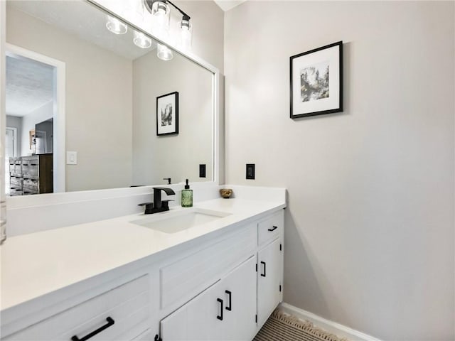 2466 Thrasher Rd, Buford, GA 30519 - bathroom featuring vanity and baseboards