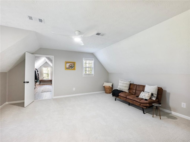 2466 Thrasher Rd, Buford, GA 30519 - living area featuring carpet floors, ceiling fan, vaulted ceiling, and baseboards