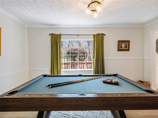 2466 Thrasher Rd, Buford, GA 30519 - playroom with billiards, a wainscoted wall, and ornamental molding
