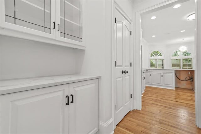 110 Glen Eagle Way, Mcdonough, GA 30253 - hall with light wood-type flooring, recessed lighting, and crown molding