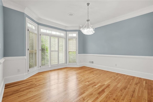 110 Glen Eagle Way, Mcdonough, GA 30253 - spare room featuring a chandelier, wood finished floors, crown molding, and baseboards
