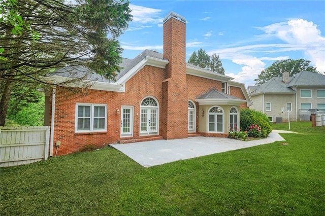 110 Glen Eagle Way, Mcdonough, GA 30253 - back of house featuring a chimney, brick siding, and a patio area