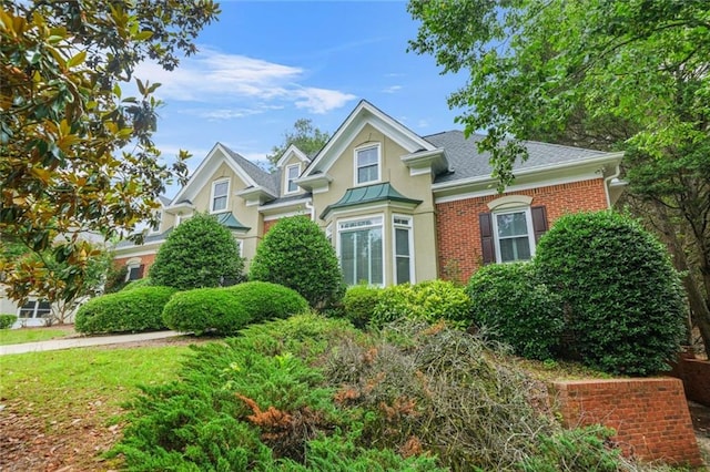 110 Glen Eagle Way, Mcdonough, GA 30253 - view of front of property with stucco siding, brick siding, and roof with shingles