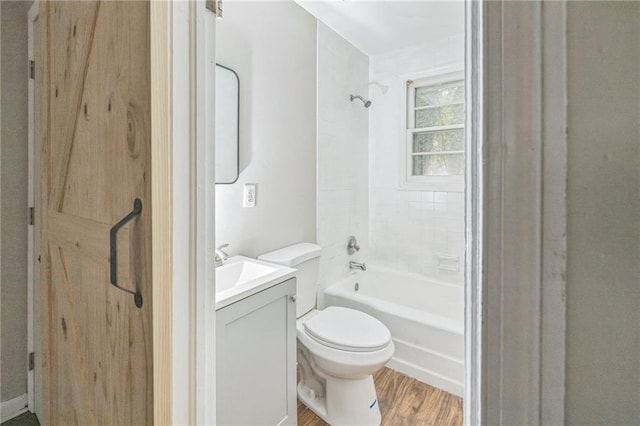 full bathroom featuring wood-type flooring, vanity, toilet, and shower / bathtub combination