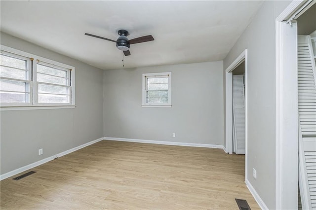 unfurnished bedroom with ceiling fan, a closet, and light hardwood / wood-style floors