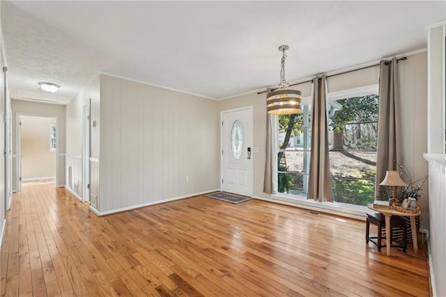 entryway featuring light wood-type flooring and baseboards