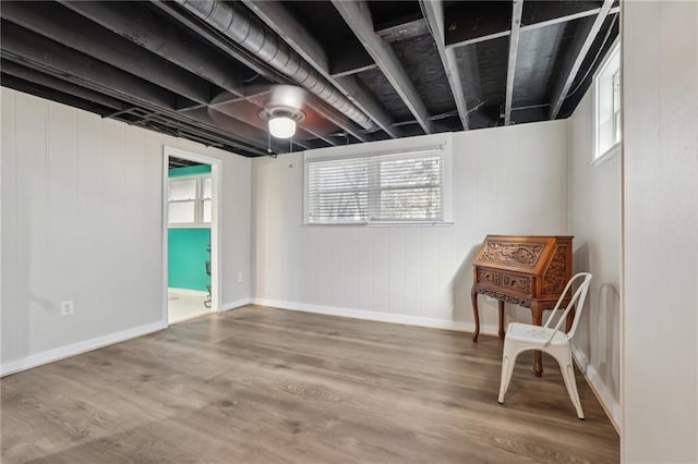 sitting room featuring baseboards and wood finished floors