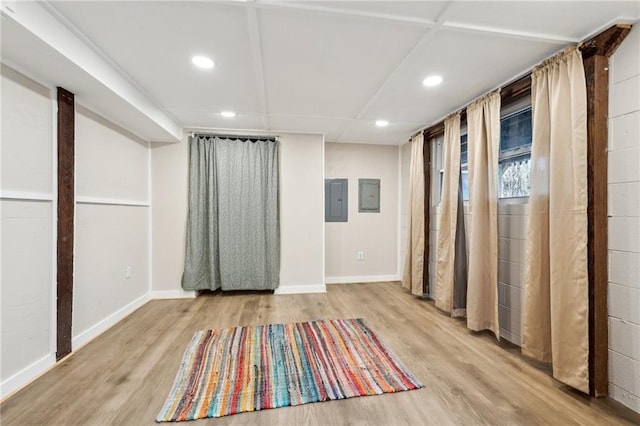 interior space with recessed lighting, baseboards, and wood finished floors