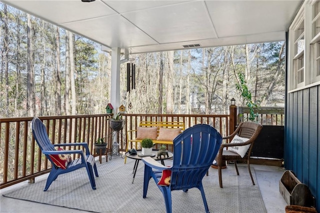 sunroom / solarium featuring visible vents