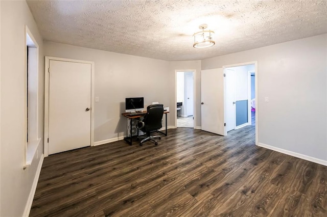 5479 Dorsett Shoals Rd, Douglasville, GA 30135 - office space featuring dark wood finished floors, baseboards, and a textured ceiling