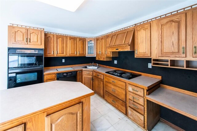 5479 Dorsett Shoals Rd, Douglasville, GA 30135 - kitchen featuring black appliances, custom exhaust hood, a sink, light countertops, and glass insert cabinets