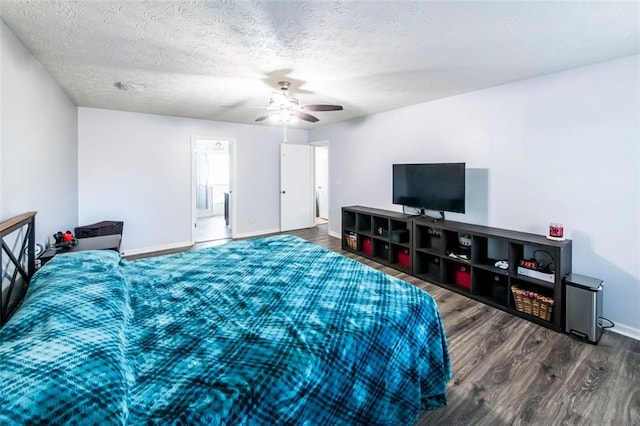 5479 Dorsett Shoals Rd, Douglasville, GA 30135 - bedroom featuring wood finished floors, baseboards, a textured ceiling, and ceiling fan