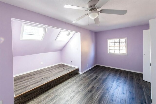 5479 Dorsett Shoals Rd, Douglasville, GA 30135 - bonus room with a skylight, ceiling fan, wood finished floors, baseboards, and lofted ceiling