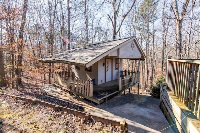 5479 Dorsett Shoals Rd, Douglasville, GA 30135 - exterior space featuring a wooden deck and stucco siding