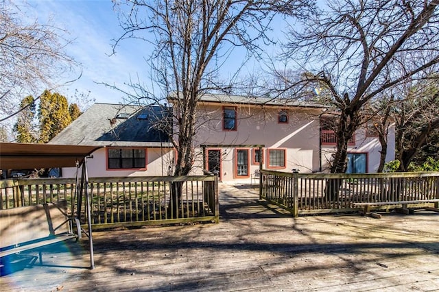 5479 Dorsett Shoals Rd, Douglasville, GA 30135 - back of property featuring a wooden deck and stucco siding