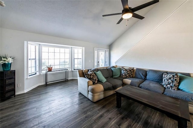 5479 Dorsett Shoals Rd, Douglasville, GA 30135 - living room with dark wood-style flooring, vaulted ceiling, a ceiling fan, and baseboards