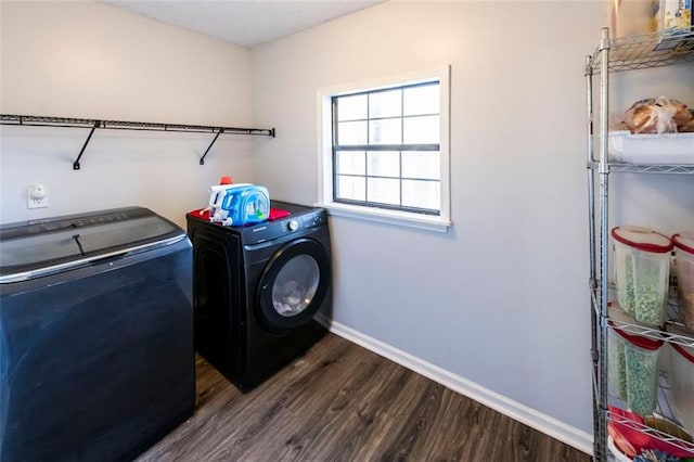 5479 Dorsett Shoals Rd, Douglasville, GA 30135 - laundry area featuring washing machine and clothes dryer, dark wood finished floors, and baseboards