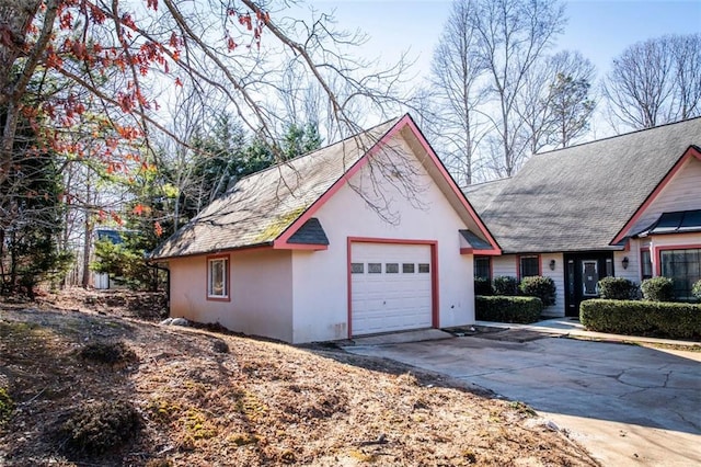 5479 Dorsett Shoals Rd, Douglasville, GA 30135 - view of front of house with an attached garage, stucco siding, and concrete driveway