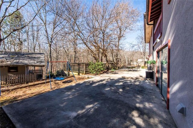 5479 Dorsett Shoals Rd, Douglasville, GA 30135 - view of patio / terrace with fence and central AC