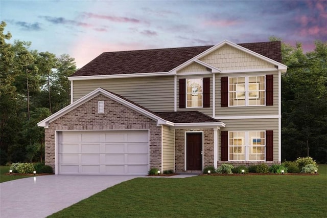 view of front of house with brick siding, driveway, a lawn, and a garage