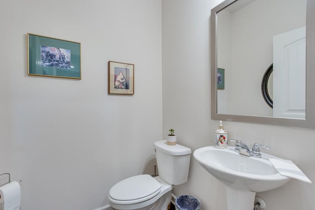 bathroom featuring toilet and sink