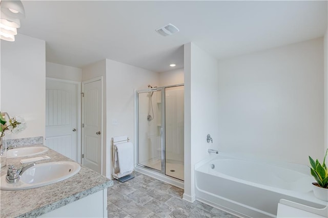 bathroom featuring vanity and separate shower and tub