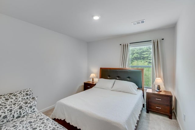 bedroom featuring light colored carpet