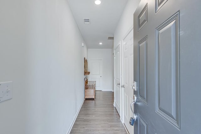 corridor featuring light hardwood / wood-style floors