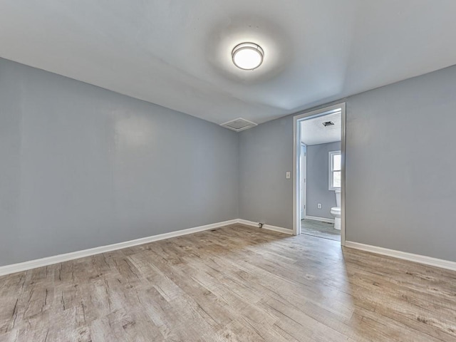 unfurnished room featuring light wood-type flooring