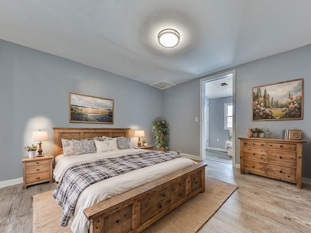 bedroom with light hardwood / wood-style flooring