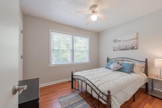 2650 Montego Dr, Buford, GA 30519 - bedroom featuring baseboards, wood finished floors, and a ceiling fan