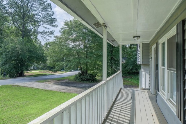 2650 Montego Dr, Buford, GA 30519 - balcony with view of wooded area and a porch