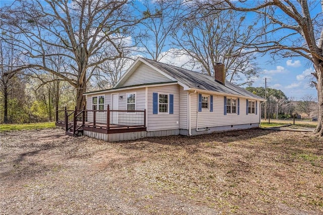 view of front of property with a chimney, crawl space, and a deck