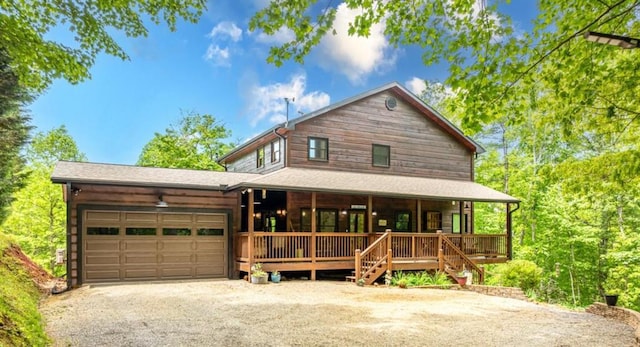 32 Grice Woods Rd, Blue Ridge, GA 30513 - view of front facade featuring a porch, a garage, and driveway