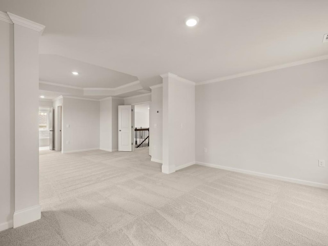 empty room featuring baseboards, recessed lighting, and crown molding