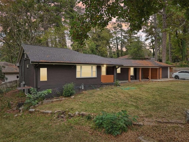 ranch-style house featuring a yard