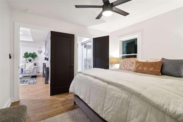 bedroom featuring light hardwood / wood-style floors and ceiling fan