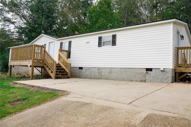 320 White Birch Dr, Covington, GA 30016 - rear view of property featuring crawl space, a deck, and stairway