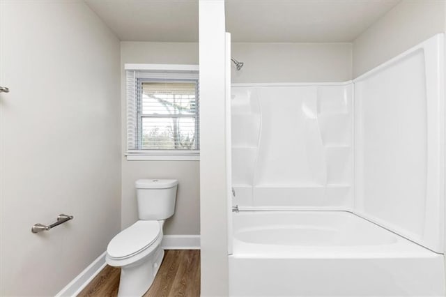 full bathroom with toilet, baseboards, and wood finished floors