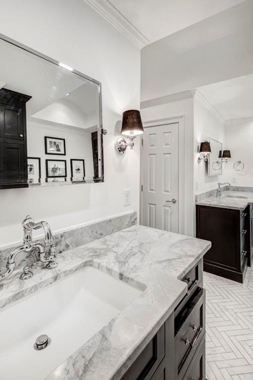 bathroom featuring vanity and ornamental molding