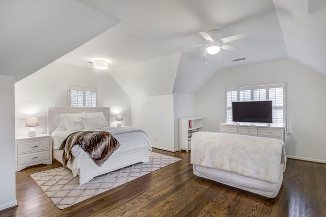 bedroom with dark wood-type flooring, ceiling fan, and vaulted ceiling