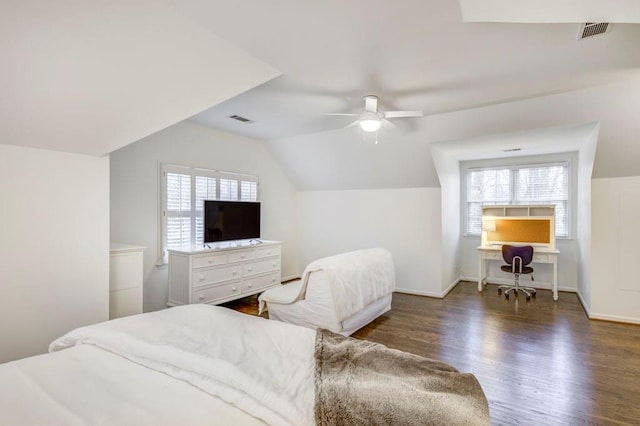 bedroom featuring vaulted ceiling, dark hardwood / wood-style floors, and ceiling fan