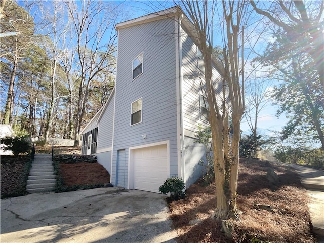 view of property exterior featuring a garage