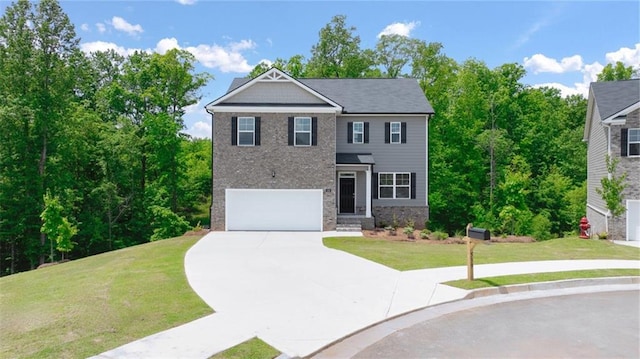 view of front facade with driveway, a garage, a front lawn, and brick siding