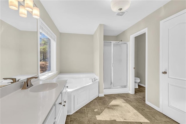 bathroom with toilet, baseboards, a shower stall, visible vents, and a bath