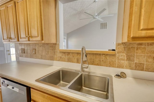 kitchen featuring visible vents, a sink, tasteful backsplash, stainless steel dishwasher, and light countertops