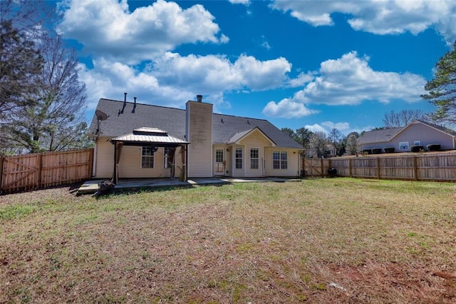 back of house with a gazebo, a yard, a patio area, and a fenced backyard