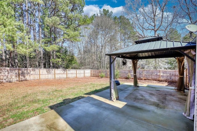 view of yard with a gazebo, a patio, and a fenced backyard