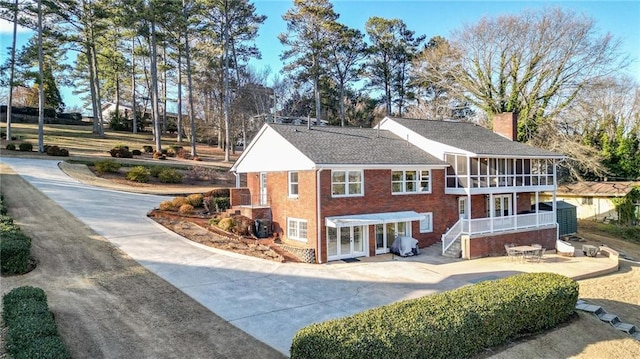 view of front of home featuring a sunroom